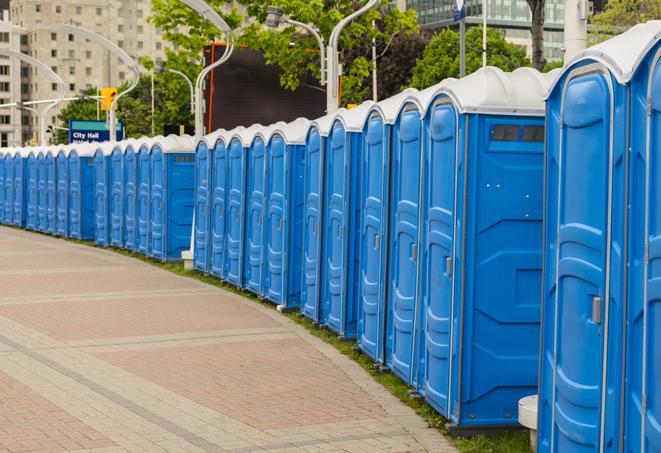 a row of portable restrooms at a fairground, offering visitors a clean and hassle-free experience in alcoa